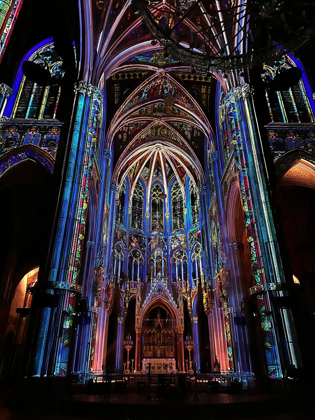 Blue and golden projections along the church vaults – LIGHT OF CREATION, Votivkirche, Vienna, Austria