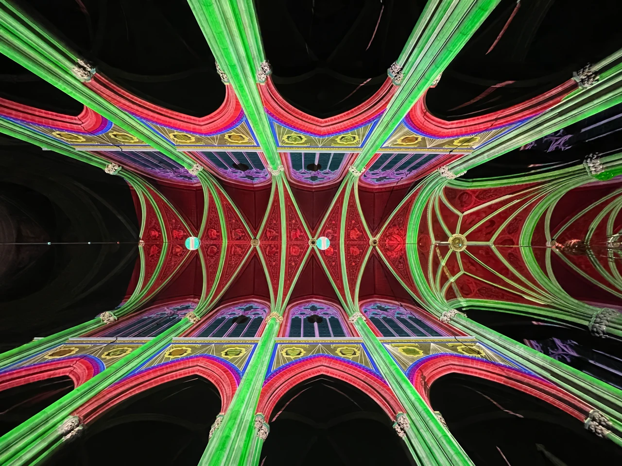 Upward view of projected lines in the church vaults – LIGHT OF CREATION, Votivkirche, Vienna, Austria