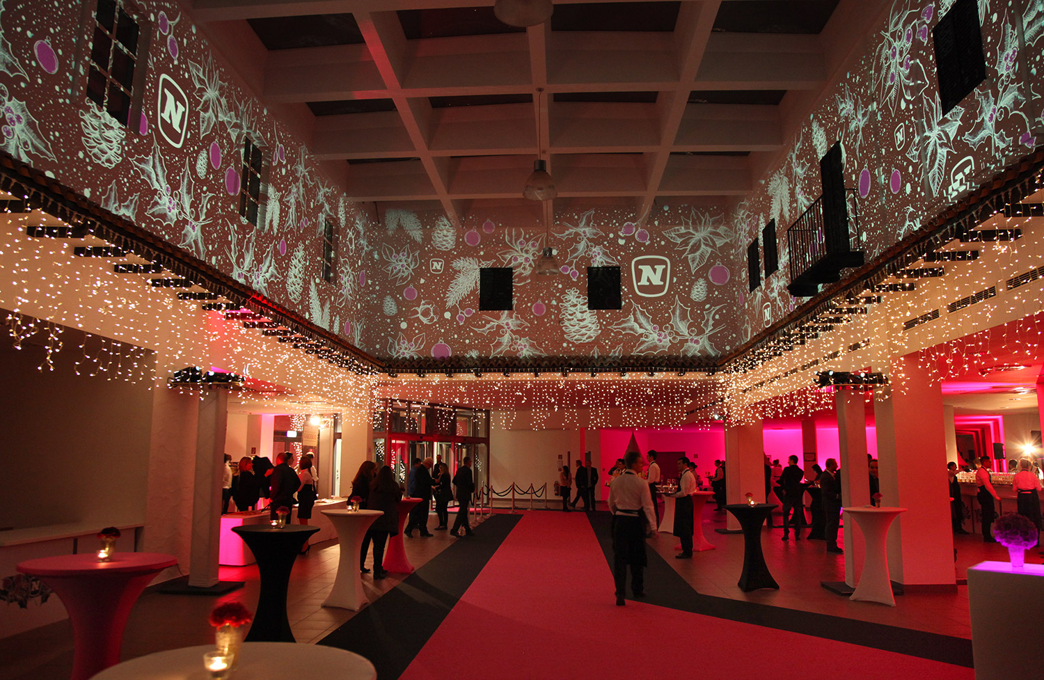 White star and brand imagery projected above guests – Novomatic, Pyramide, Vösendorf, Austria