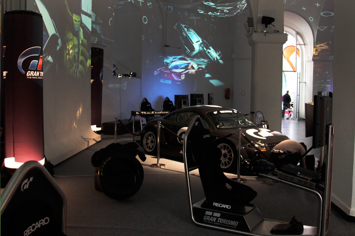 Displayed Gran Turismo car in front of projected game imagery – Sony PlayStation, Ovalhalle, MuseumsQuartier, Vienna, Austria