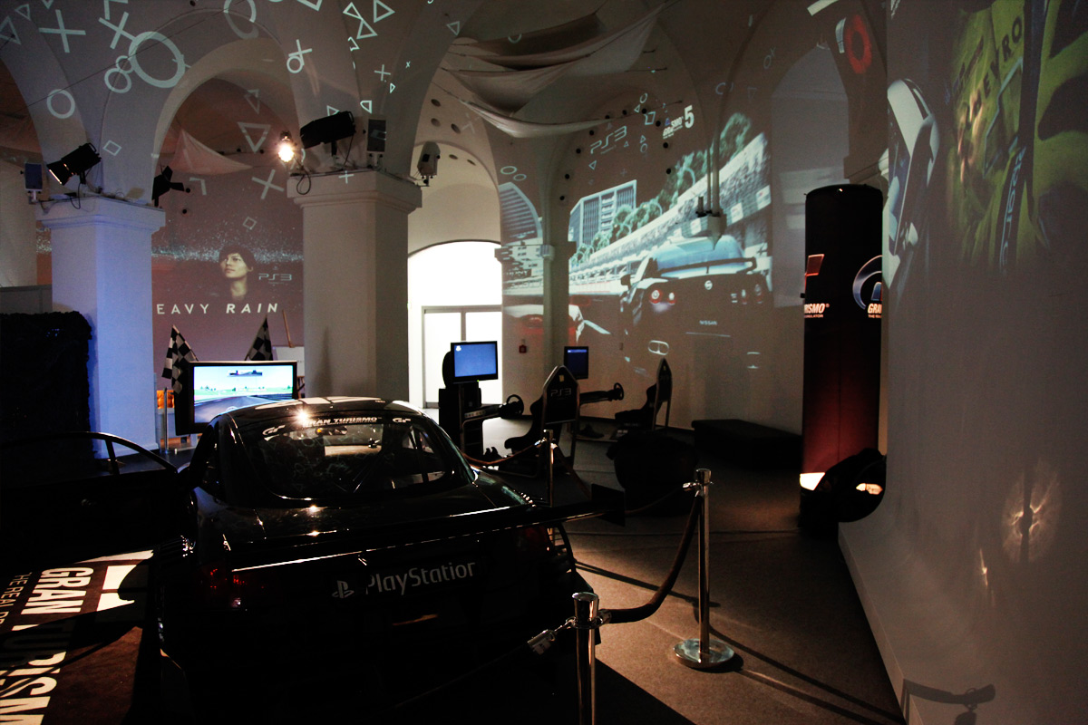 Displayed Gran Turismo car in front of projected game imagery – Sony PlayStation, Ovalhalle, MuseumsQuartier, Vienna, Austria
