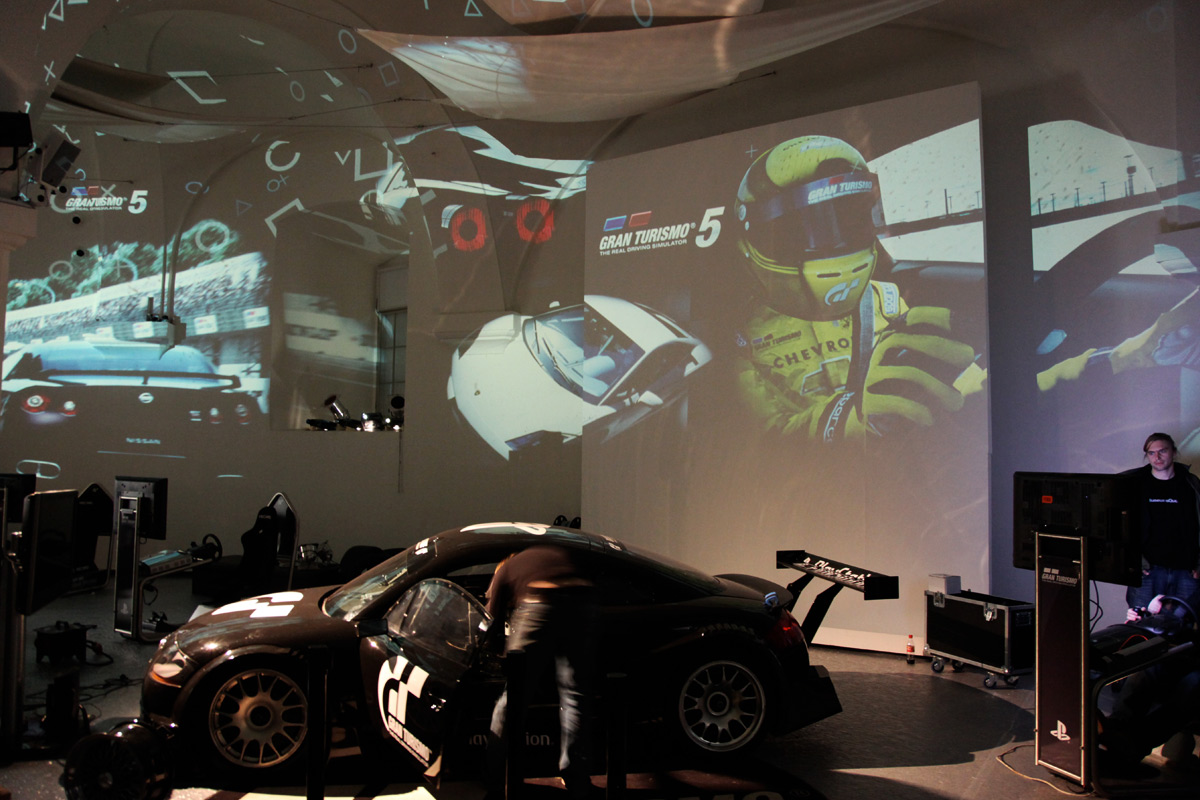 Displayed Gran Turismo car in front of projected game imagery – Sony PlayStation, Ovalhalle, MuseumsQuartier, Vienna, Austria