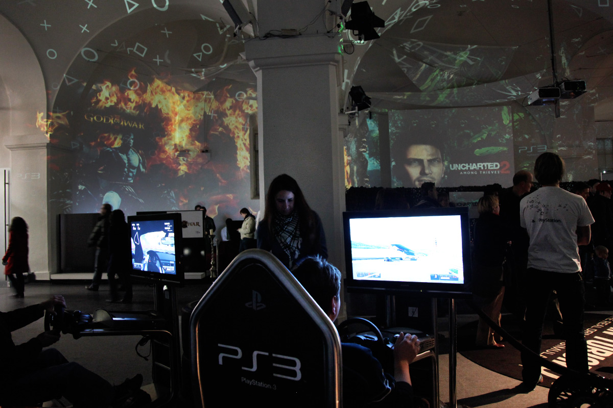 PlayStation game imagery projected above the gaming stations – Sony PlayStation, Ovalhalle, MuseumsQuartier, Vienna, Austria