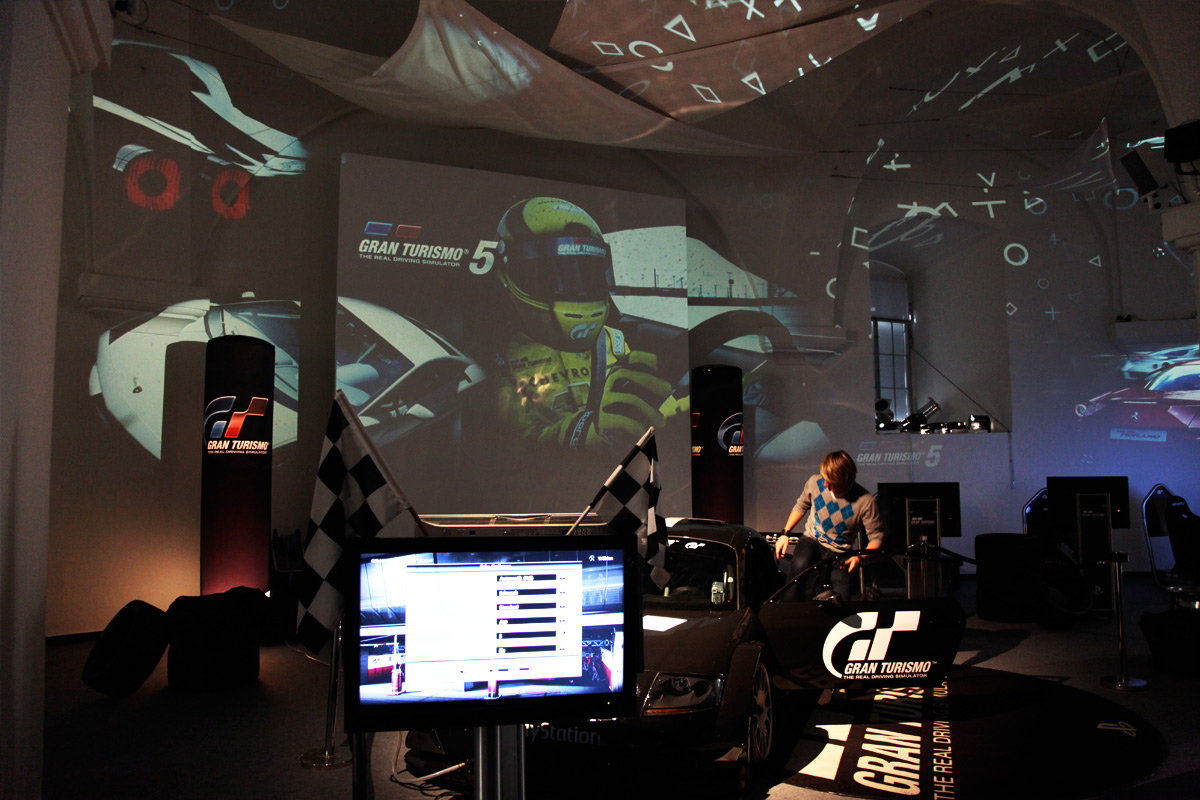 PlayStation game imagery projected above the gaming stations – Sony PlayStation, Ovalhalle, MuseumsQuartier, Vienna, Austria
