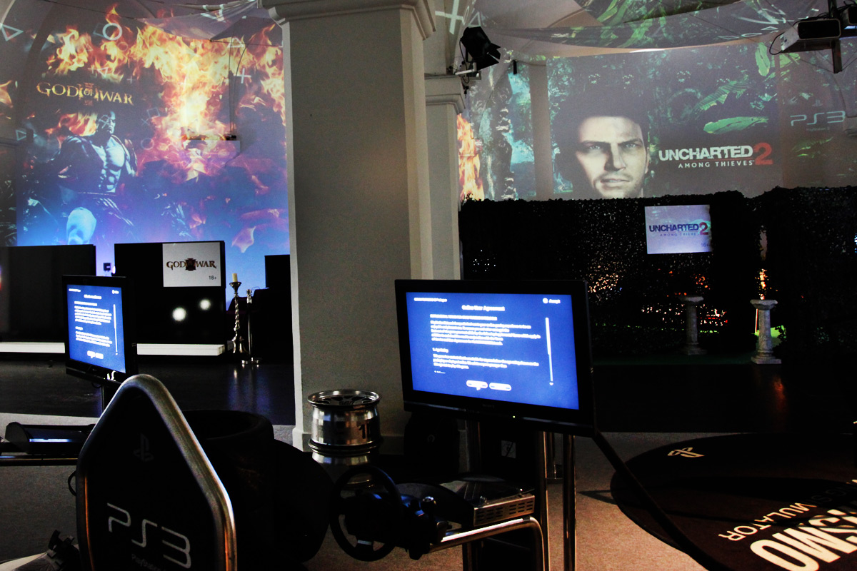 PlayStation game imagery projected above the gaming stations – Sony PlayStation, Ovalhalle, MuseumsQuartier, Vienna, Austria