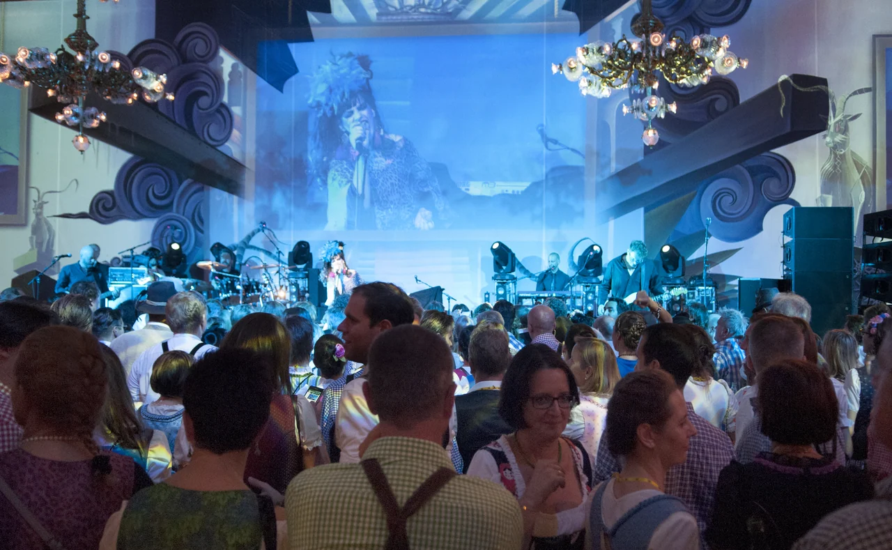 Blue stage and spatial projections above the ball audience – ALMDUDLER TRACHTEN-PÄRCHENBALL, City Hall, Vienna, Austria