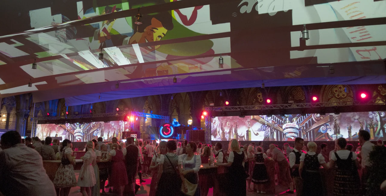 Illustrations as a panoramic projection behind ball guests – ALMDUDLER TRACHTEN-PÄRCHENBALL, City Hall, Vienna, Austria