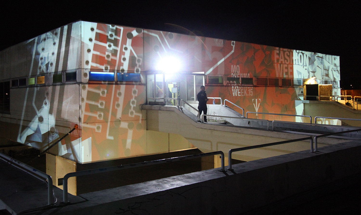 Fashion Week lettering and graphic imagery projected onto a facade – Fashion Week Afterparty, Kantine, Vienna, Austria
