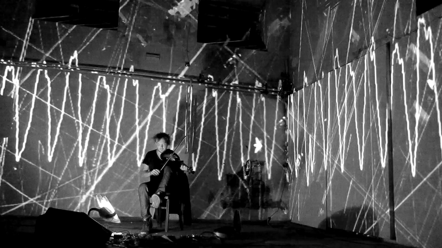 Black and white line projections around a violinist – Matthias Jakisic, Vienna, Austria