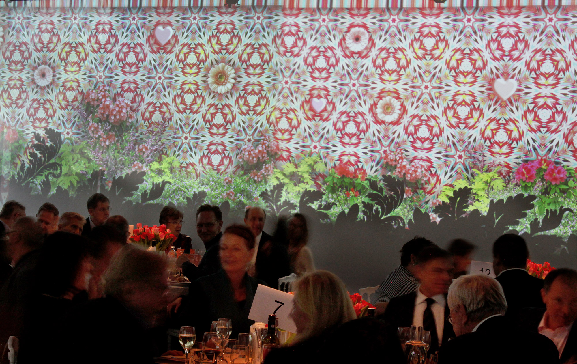 Close view of ornamental projections behind guests – Art Brut, Kunstforum, Vienna, Austria