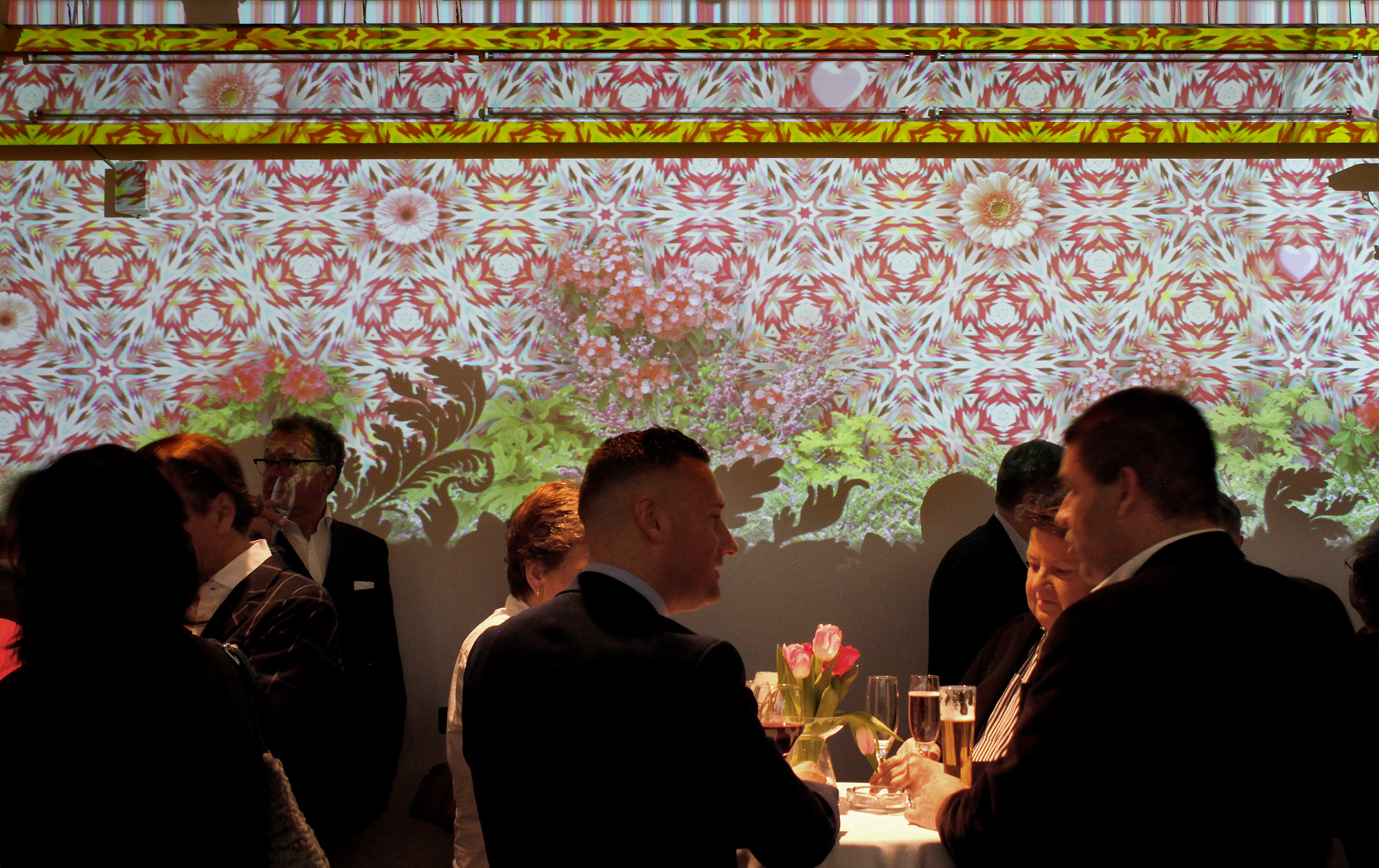 Close view of ornamental projections behind guests – Art Brut, Kunstforum, Vienna, Austria